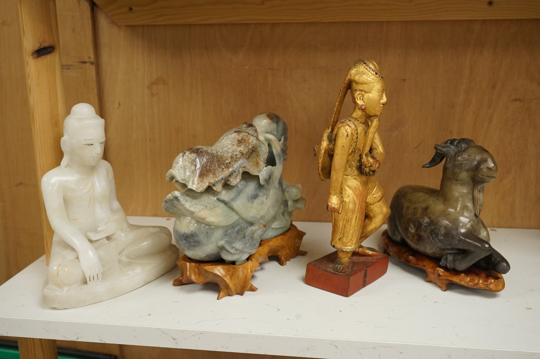Two modern jade figures, together with a marble Buddha and a carved giltwood figure, largest 24cm wide